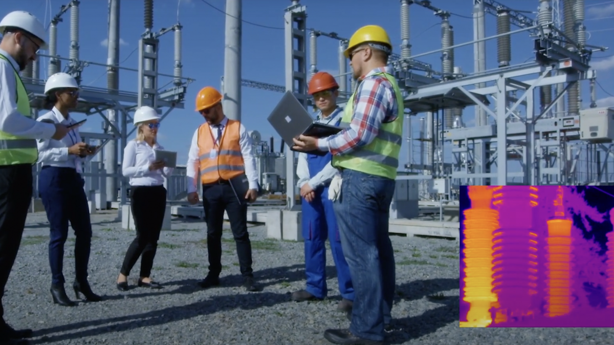 Workers at a power plant with infrared technology showing the heat from transformers